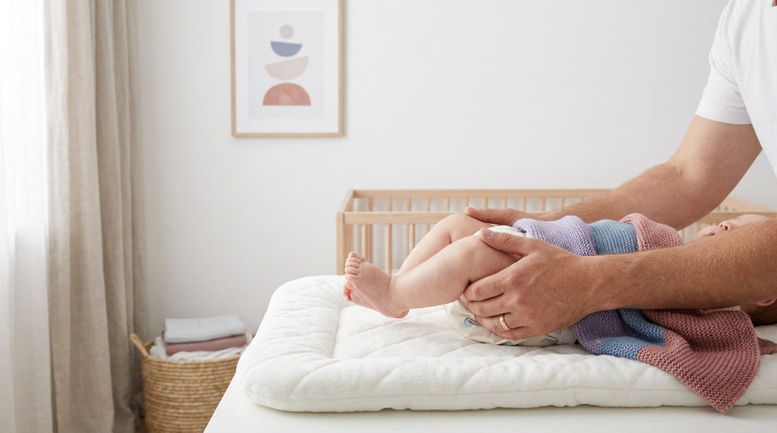 how to hold baby's legs when changing diaper?